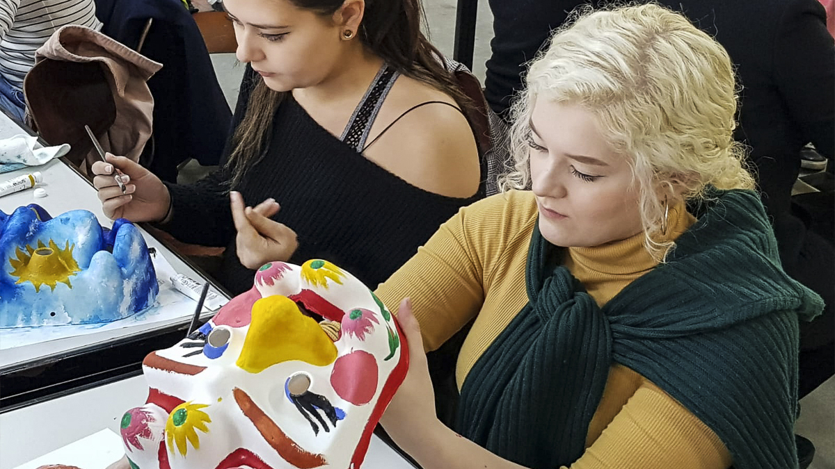 Students painting masks