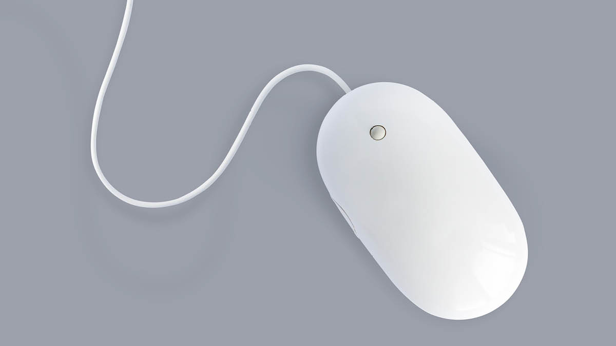 White corded computer mouse on a grey background