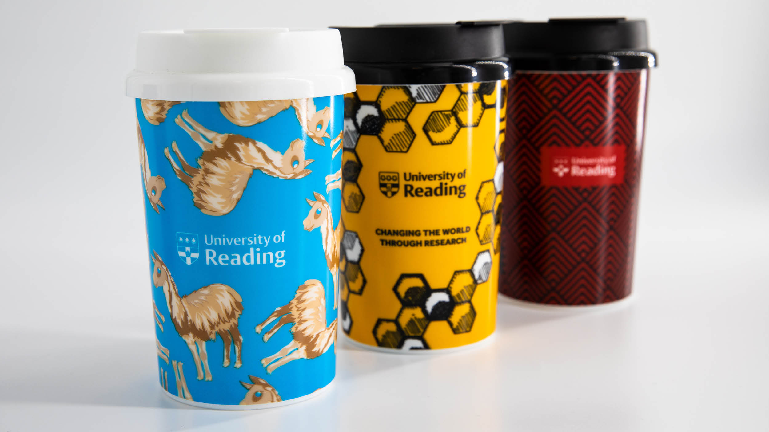 Collection of reusable cups, llama, bee and art deco designs