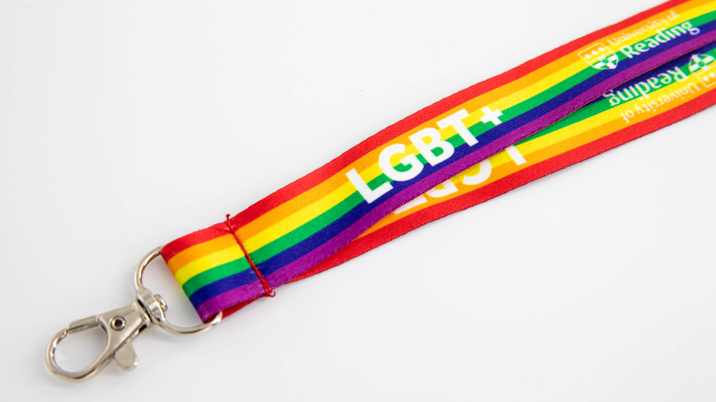 University of Reading lanyard for LGBT+ allies featuring colourful stripes