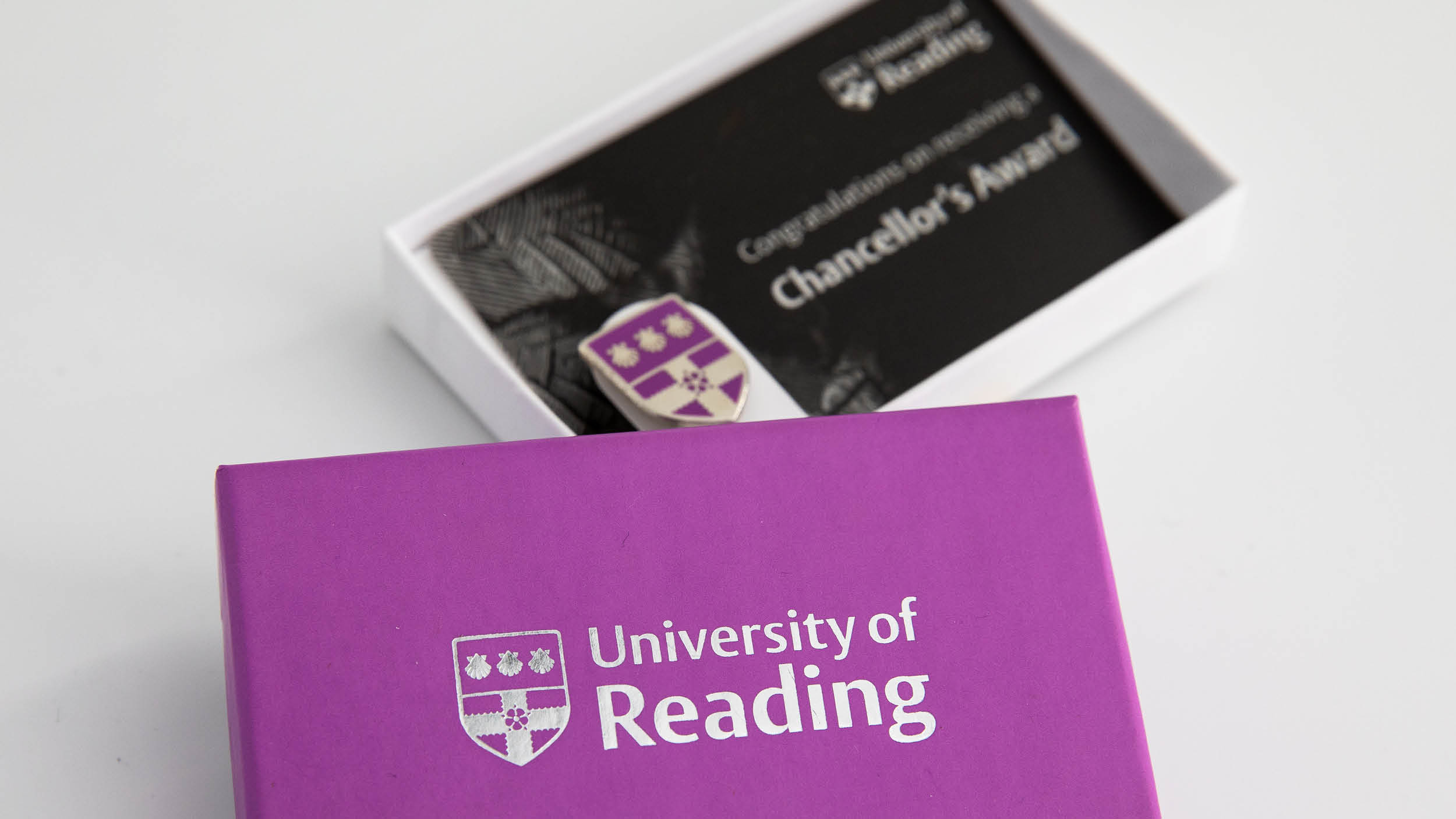 Chancellors Award enamel pin badge with presentation card and box