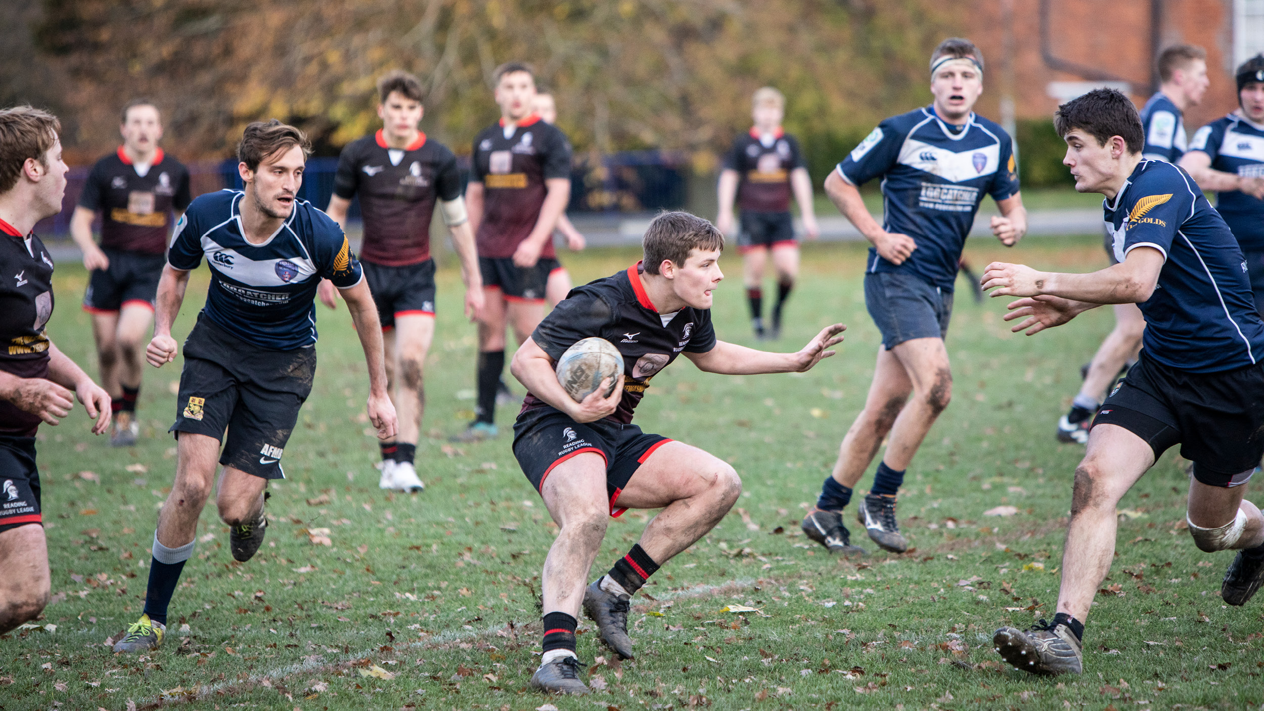 Action shot of students playing rugby