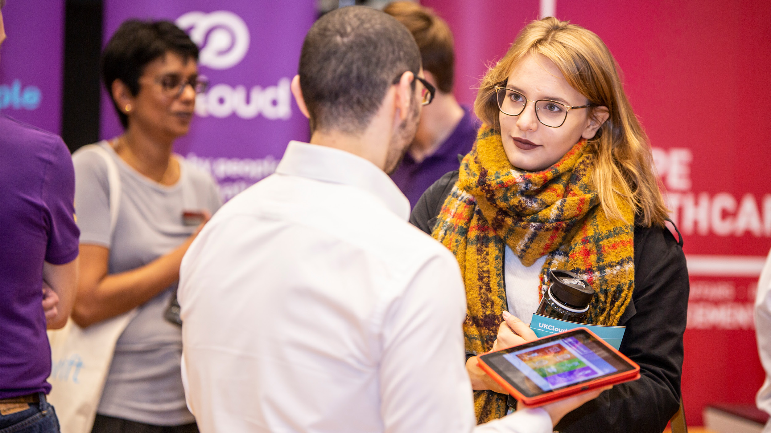 Female student talks with a recruiter at a careers fair