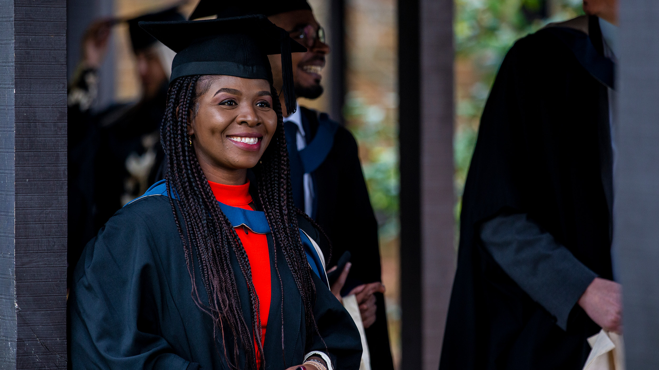 Female student smiles at Graduation