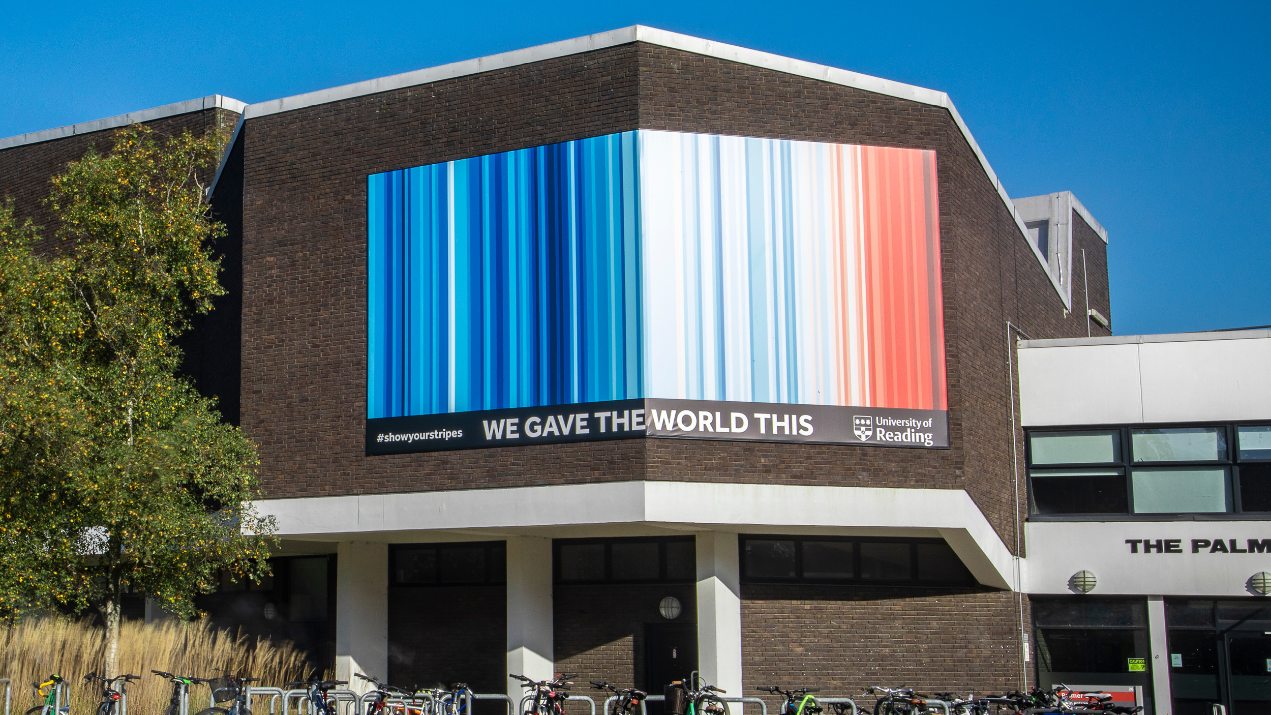 The climate stripes displayed on a huge banner on the Palmer Building