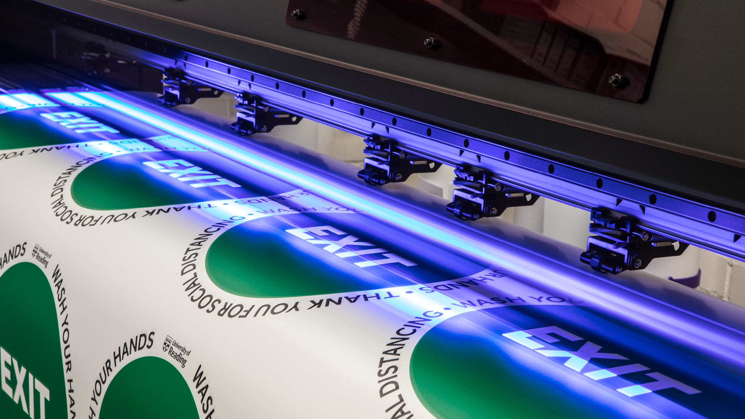 Photo showing print being UV cured during the printing process