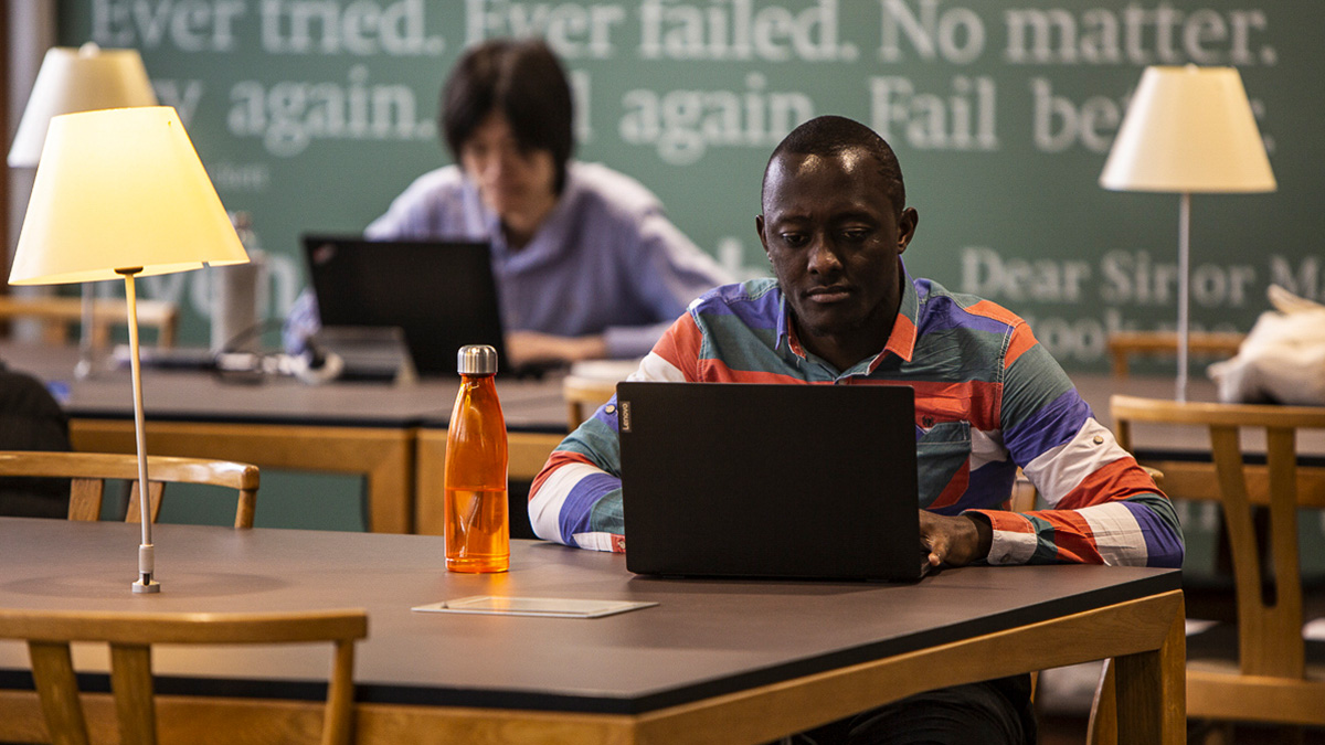 Students working on laptops in the library