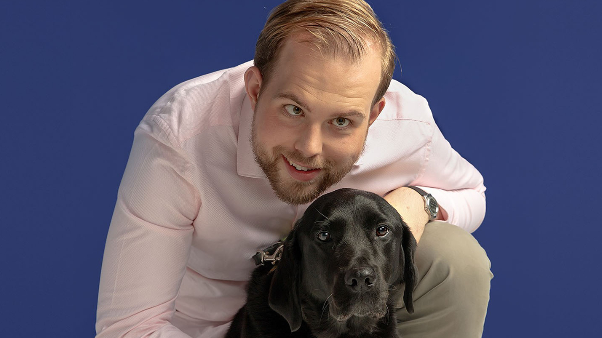 George Upfield photographed with his guide dog