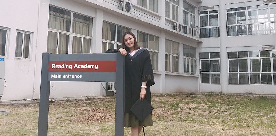 Kexin Zhao in front of a building