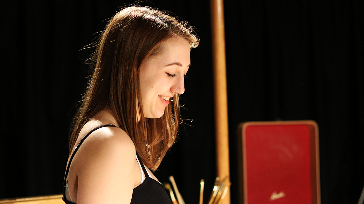 students looking into a film camera