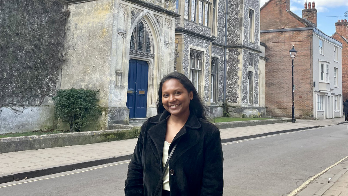 Alpana Chandrashekar standing outside and smiling