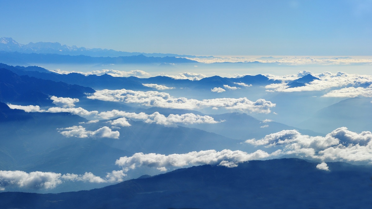 Ariel shot of clouds and mountain