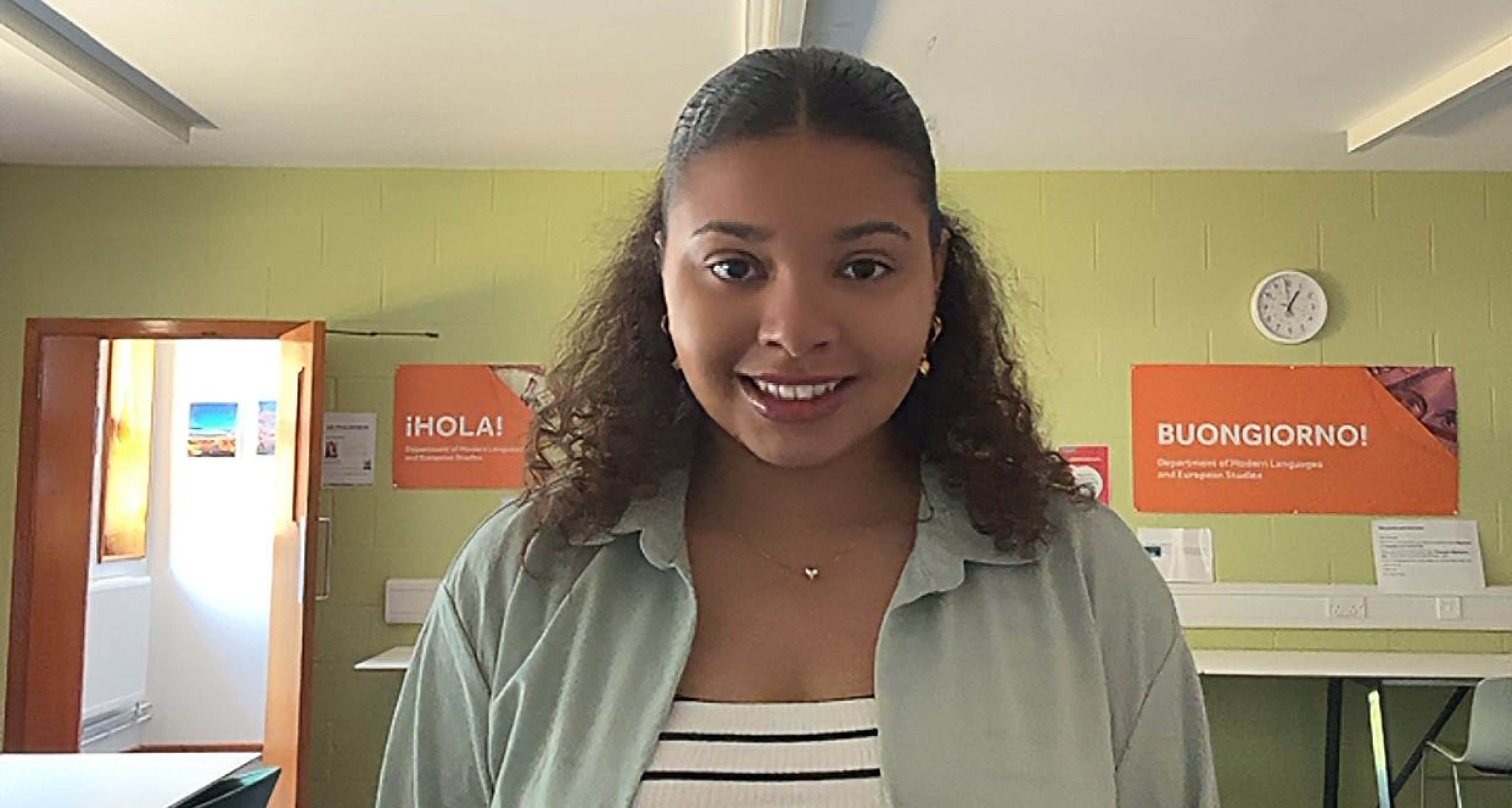 Student Mia Morgan smiling to camera, in a classroom